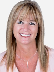 Woman after upper veneers and porcelain bridge