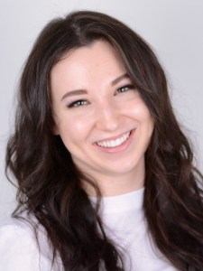 Woman after Upper Porcelain (2) Veneers and Invisalign 