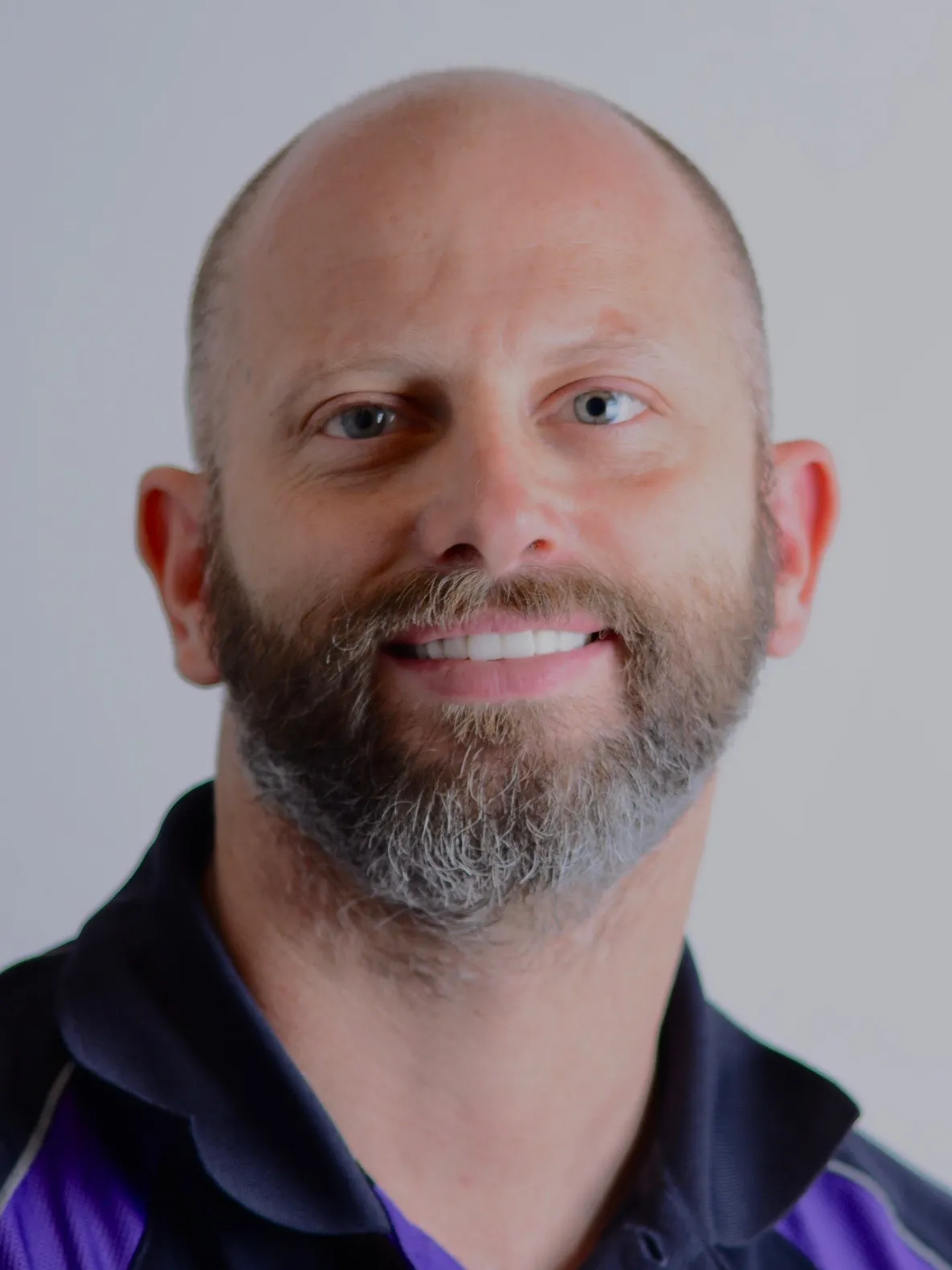 Smiling man after receiving veneers and dental implants